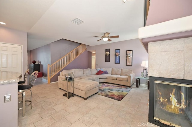11180 Bridgefield Ct, Riverside, CA 92505 - living area with a ceiling fan, stairway, and a multi sided fireplace