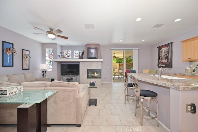 11180 Bridgefield Ct, Riverside, CA 92505 - living room with ceiling fan, light tile patterned flooring, and recessed lighting