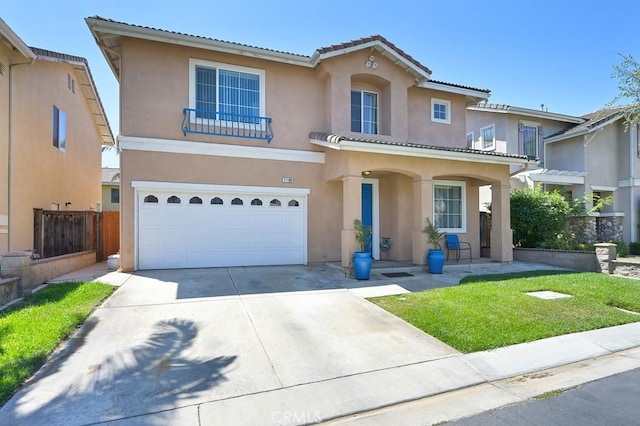 11180 Bridgefield Ct, Riverside, CA 92505 - mediterranean / spanish-style home featuring an attached garage, stucco siding, a tiled roof, and driveway