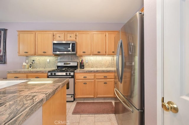 11180 Bridgefield Ct, Riverside, CA 92505 - kitchen with stainless steel appliances, tile counters, decorative backsplash, and light brown cabinets