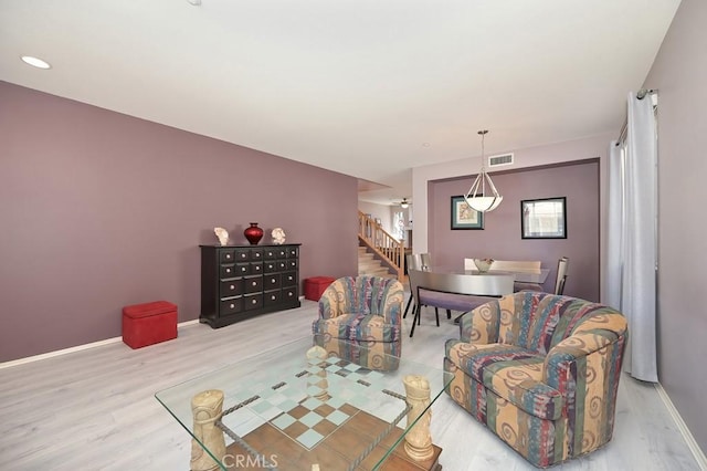 11180 Bridgefield Ct, Riverside, CA 92505 - living area with wood finished floors and stairway