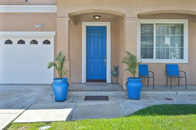 11180 Bridgefield Ct, Riverside, CA 92505 - entrance to property with stucco siding and a garage