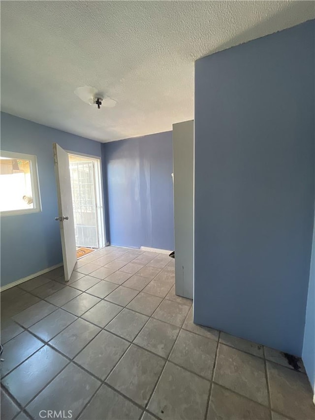1130 S Rene Dr, Santa Ana, CA 92704 - unfurnished room with tile patterned floors and a textured ceiling