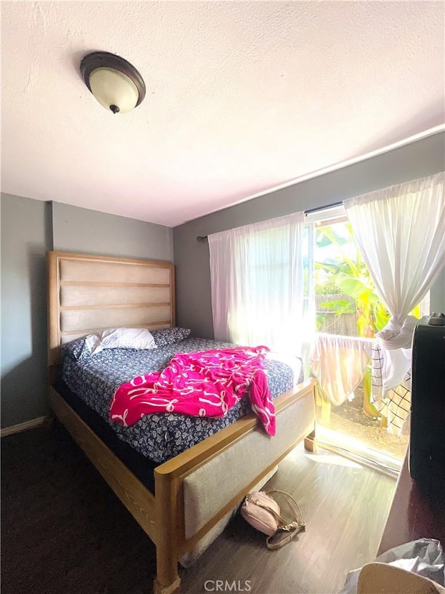 1130 S Rene Dr, Santa Ana, CA 92704 - bedroom with a textured ceiling and wood finished floors