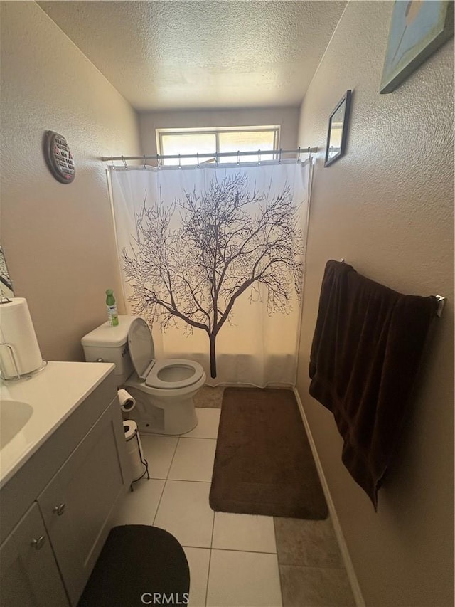 7103 Hanford Ave, Yucca Valley, CA 92284 - full bath featuring a textured ceiling, vanity, and tile patterned flooring