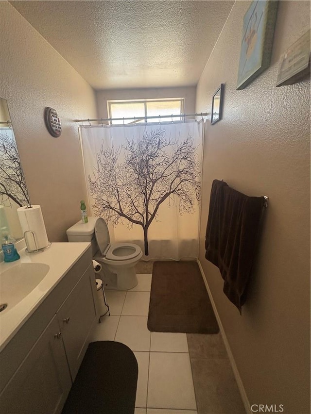7103 Hanford Ave, Yucca Valley, CA 92284 - bathroom featuring vanity, a textured ceiling, tile patterned flooring, and a textured wall