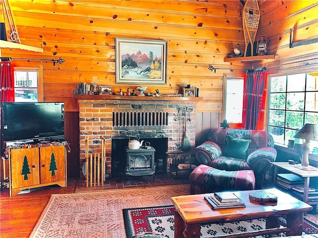 33140 Juniper Ln, Green Valley Lake, CA 92341 - living room with a wood stove, wooden walls, and wood finished floors