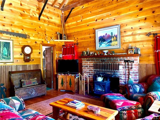 33140 Juniper Ln, Green Valley Lake, CA 92341 - living room featuring a wood stove, wooden walls, and wood finished floors