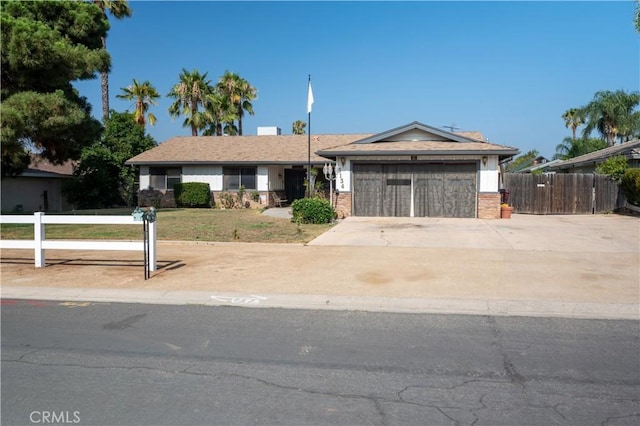 3134 Half Circle Rd, Norco, CA 92860 - ranch-style home with an attached garage, brick siding, and concrete driveway