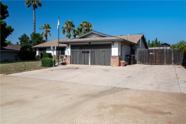 3134 Half Circle Rd, Norco, CA 92860 - view of front of house featuring a garage, brick siding, and driveway
