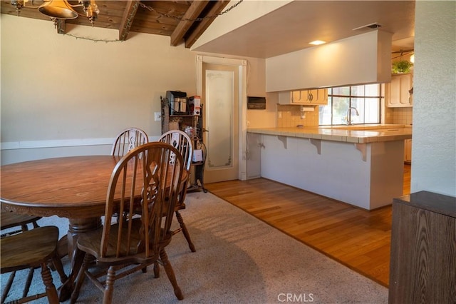 3134 Half Circle Rd, Norco, CA 92860 - dining area with light wood-style flooring and a wood ceiling with exposed beams