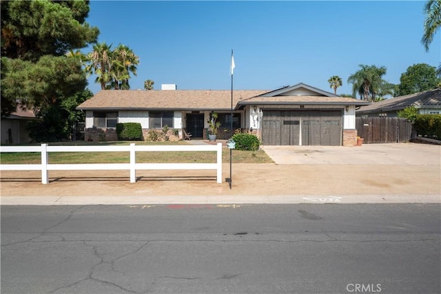 3134 Half Circle Rd, Norco, CA 92860 - ranch-style house with a garage, driveway, and brick siding