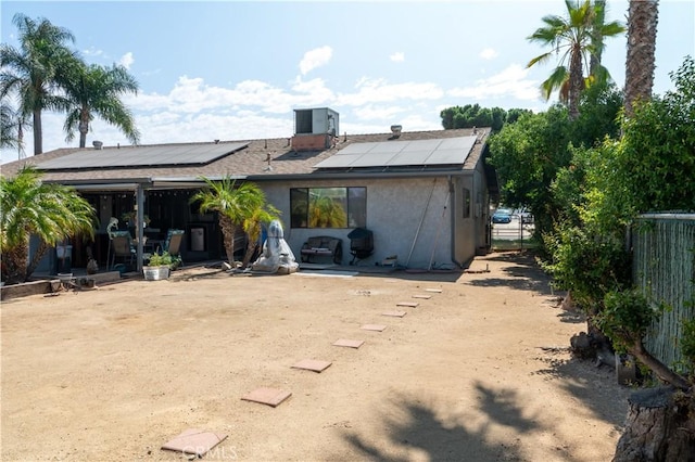 3134 Half Circle Rd, Norco, CA 92860 - rear view of house with roof mounted solar panels and stucco siding