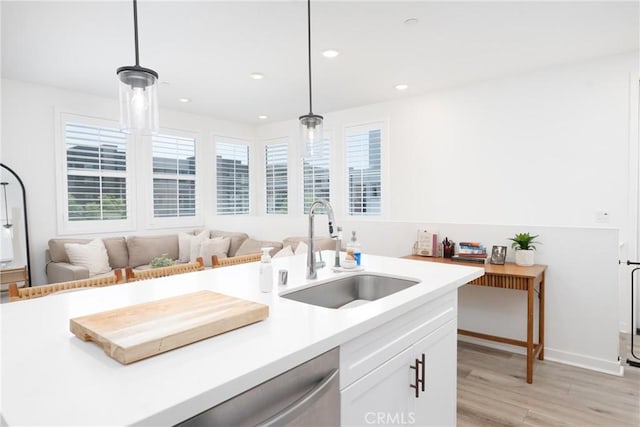 11046 Wander Dr, Rancho Cucamonga, CA 91730 - kitchen featuring light wood-style flooring, white cabinetry, light countertops, decorative light fixtures, and recessed lighting