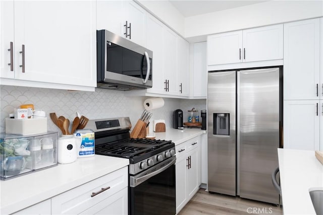 11046 Wander Dr, Rancho Cucamonga, CA 91730 - kitchen featuring stainless steel appliances, light countertops, white cabinets, and decorative backsplash