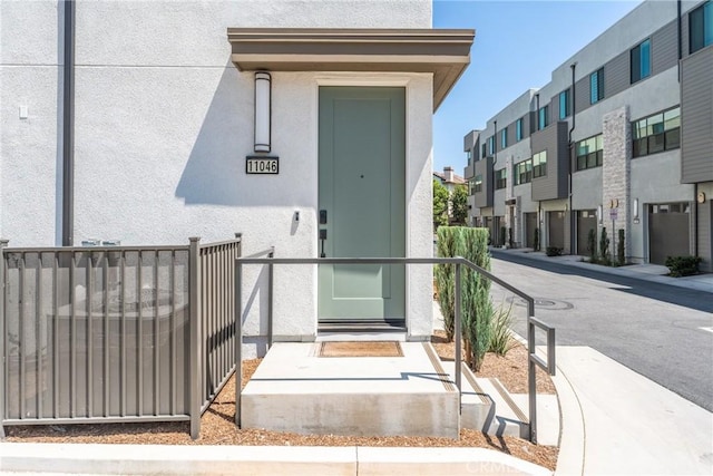 11046 Wander Dr, Rancho Cucamonga, CA 91730 - entrance to property featuring stucco siding and a residential view