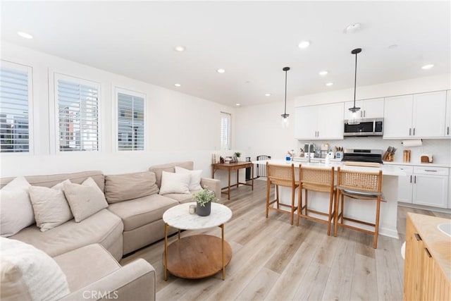11046 Wander Dr, Rancho Cucamonga, CA 91730 - living room featuring recessed lighting and light wood-style flooring