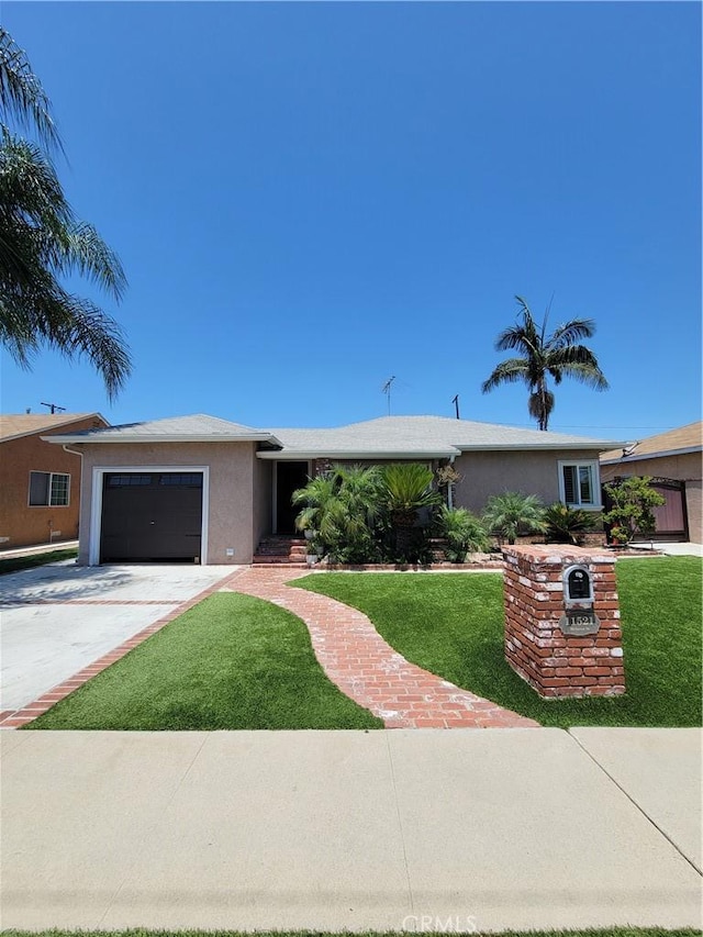 11521 Mclaren St, Norwalk, CA 90650 - ranch-style house featuring stucco siding, a garage, a front yard, and driveway