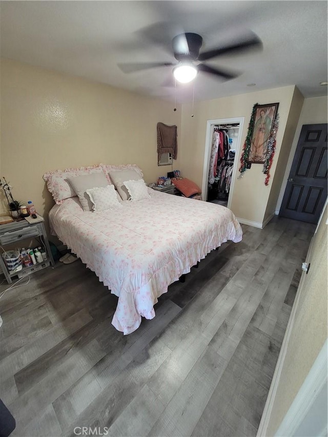 11521 Mclaren St, Norwalk, CA 90650 - bedroom with wood finished floors, a spacious closet, and a ceiling fan