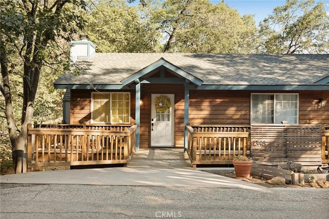 1348 Manzanita Way, Lake Arrowhead, CA 92352 - view of front of home featuring roof with shingles and a chimney