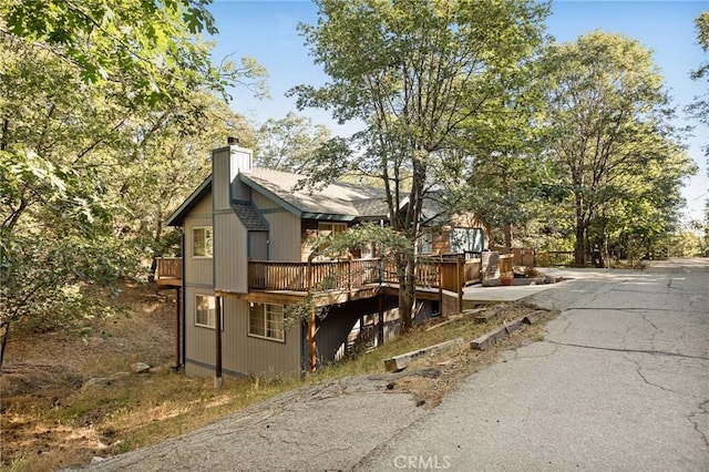 1348 Manzanita Way, Lake Arrowhead, CA 92352 - view of property exterior featuring a chimney and a wooden deck