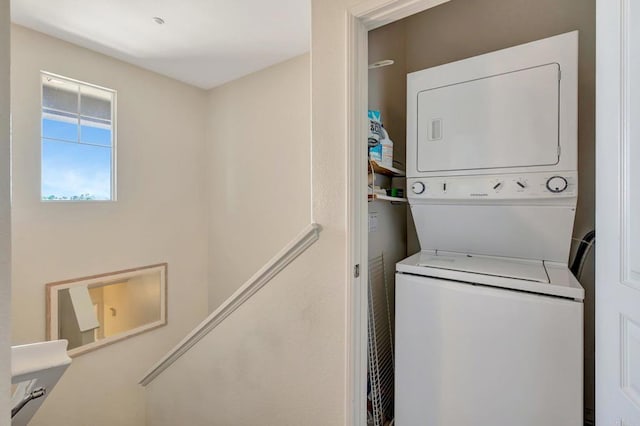 14658 Via Fiesta Unit 2, San Diego, CA 92127 - laundry area featuring stacked washer and clothes dryer