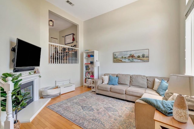 14658 Via Fiesta Unit 2, San Diego, CA 92127 - living area with a glass covered fireplace and wood finished floors