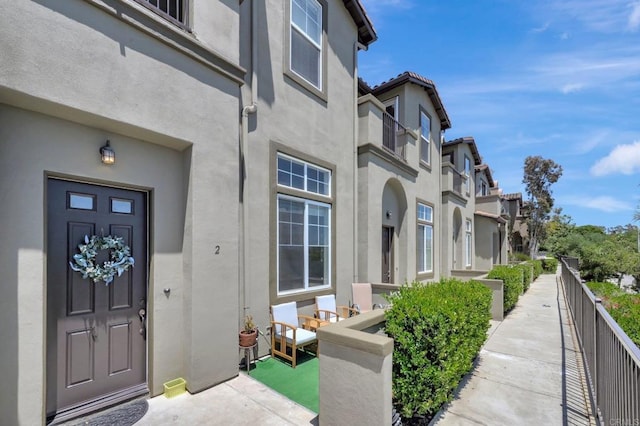 14658 Via Fiesta Unit 2, San Diego, CA 92127 - doorway to property with stucco siding and a residential view