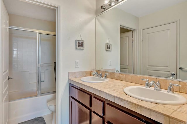 14658 Via Fiesta Unit 2, San Diego, CA 92127 - bathroom featuring double vanity and shower / bath combination with glass door
