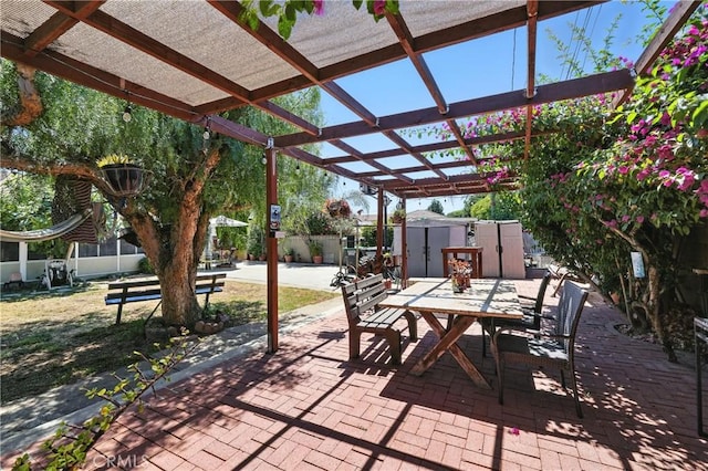123 E Andrix St, Monterey Park, CA 91755 - view of patio featuring a storage shed, outdoor dining space, and a pergola