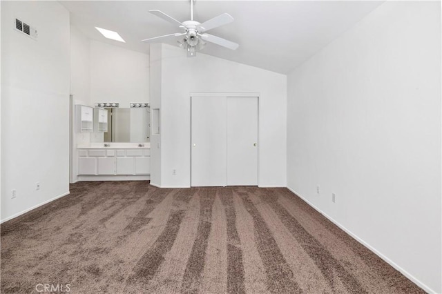 1083 Mill Iron Way, San Jacinto, CA 92583 - unfurnished bedroom featuring carpet flooring, ensuite bathroom, a closet, a skylight, and a ceiling fan