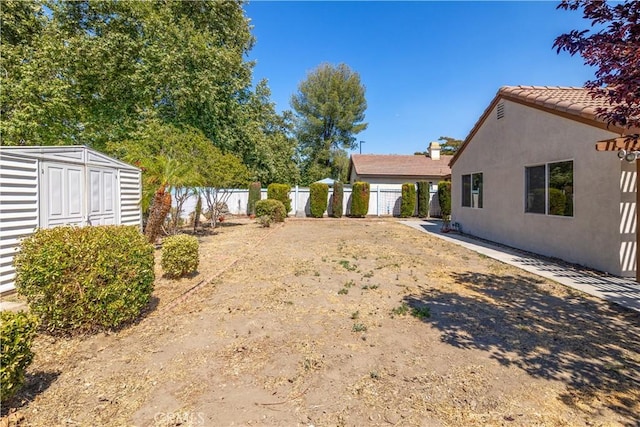 1083 Mill Iron Way, San Jacinto, CA 92583 - view of yard with a shed