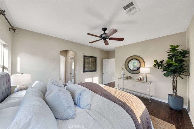 28889 Edenton Way, Temecula, CA 92591 - bedroom with arched walkways, wood finished floors, and a ceiling fan