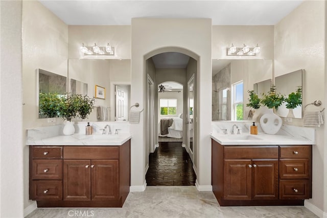 28889 Edenton Way, Temecula, CA 92591 - ensuite bathroom featuring two vanities, marble finish flooring, ceiling fan, and a shower