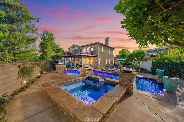 28889 Edenton Way, Temecula, CA 92591 - view of swimming pool with an in-ground hot tub, a fenced backyard, and a patio