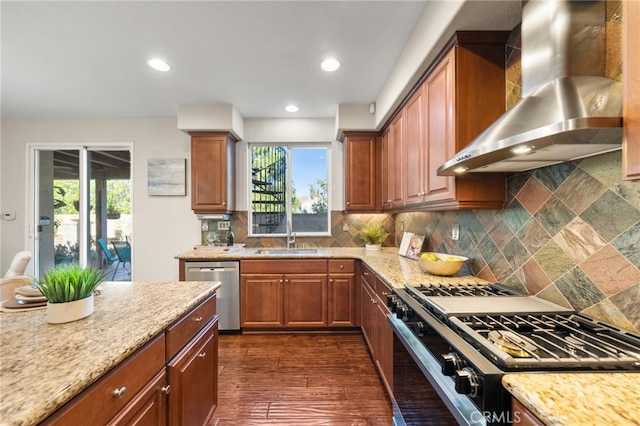 28889 Edenton Way, Temecula, CA 92591 - kitchen with wall chimney exhaust hood, appliances with stainless steel finishes, tasteful backsplash, light stone counters, and brown cabinets
