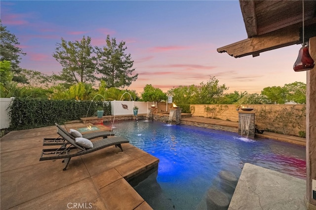 28889 Edenton Way, Temecula, CA 92591 - pool at dusk with a fenced backyard and a patio area