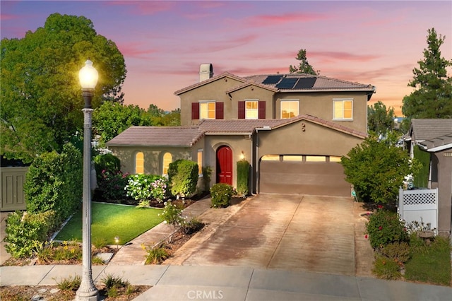 28889 Edenton Way, Temecula, CA 92591 - mediterranean / spanish house with roof mounted solar panels, stucco siding, driveway, a tile roof, and a chimney