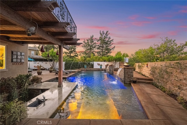 28889 Edenton Way, Temecula, CA 92591 - pool at dusk featuring a fenced backyard and a patio