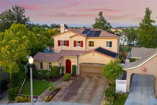 28889 Edenton Way, Temecula, CA 92591 - mediterranean / spanish home with concrete driveway, stucco siding, solar panels, a chimney, and a tile roof