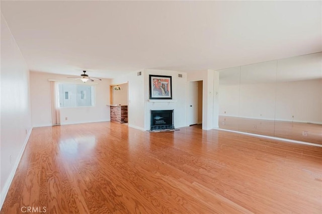 9576 Via Bernardo, Burbank, CA 91504 - unfurnished living room featuring wood finished floors, a fireplace with flush hearth, and ceiling fan