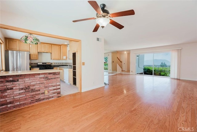 9576 Via Bernardo, Burbank, CA 91504 - kitchen featuring appliances with stainless steel finishes, light wood finished floors, light brown cabinets, open floor plan, and light countertops