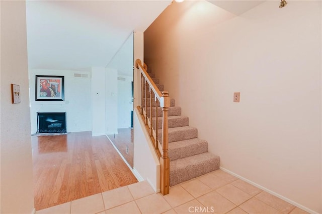 9576 Via Bernardo, Burbank, CA 91504 - stairway with a fireplace and wood finished floors