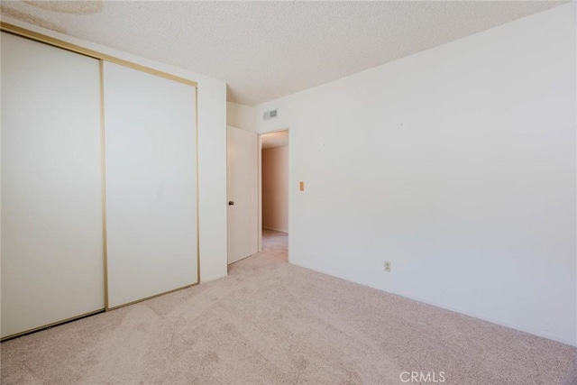 9576 Via Bernardo, Burbank, CA 91504 - unfurnished bedroom featuring carpet flooring, a textured ceiling, and a closet