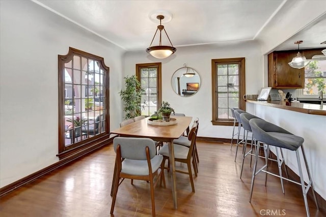 239 Nieto Ave Unit A, Long Beach, CA 90803 - dining space featuring healthy amount of natural light and dark wood-style flooring