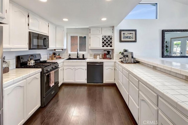 239 Nieto Ave Unit A, Long Beach, CA 90803 - kitchen featuring black appliances, white cabinets, tile countertops, recessed lighting, and dark wood finished floors