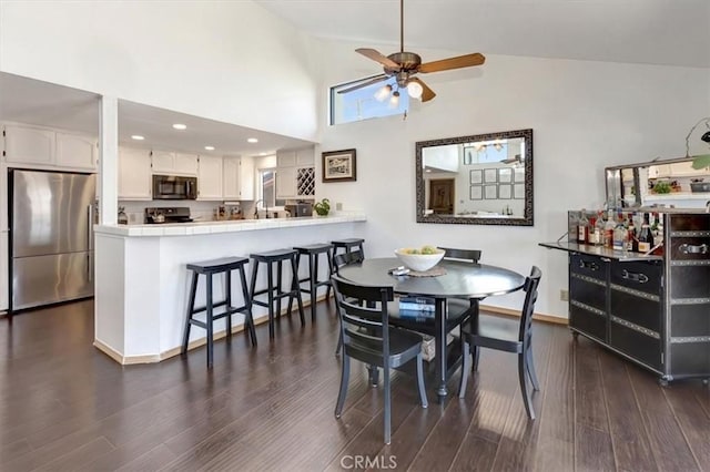 239 Nieto Ave Unit A, Long Beach, CA 90803 - dining space with high vaulted ceiling, dark wood-style floors, and a ceiling fan