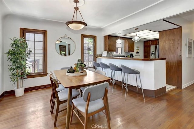 239 Nieto Ave Unit A, Long Beach, CA 90803 - dining space with wood finished floors and baseboards