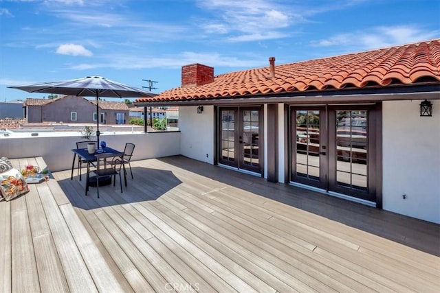 239 Nieto Ave Unit A, Long Beach, CA 90803 - wooden terrace with french doors and outdoor dining area
