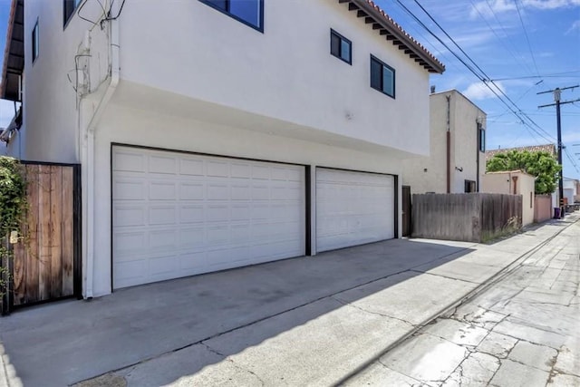 239 Nieto Ave Unit A, Long Beach, CA 90803 - view of home's exterior featuring stucco siding, a garage, and driveway
